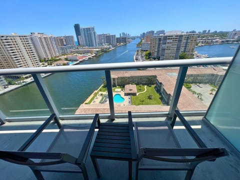Private balcony with outdoor seating and skyline views.