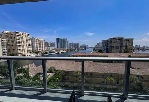 Private balcony with outdoor seating and skyline views.