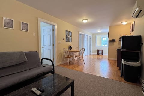 Open concept with Kitchenette, Living room, and dining area with both bedrooms and bathrooms off of the space