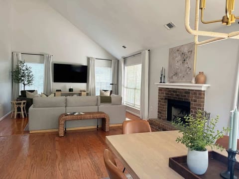 Our large living room is connected to the dining room by a beautiful, non-functional fireplace that really brings out the coziness this home has to offer. 