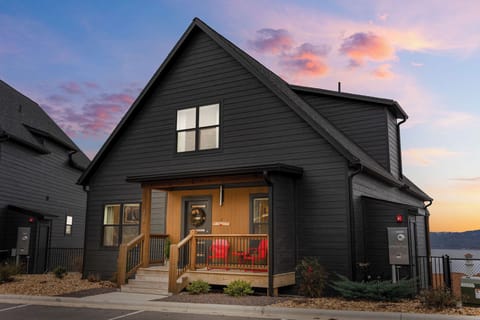 Stylish cabin blends modern design with rustic charm, offering stunning lake views, cozy comforts, and a front porch made for unforgettable sunsets