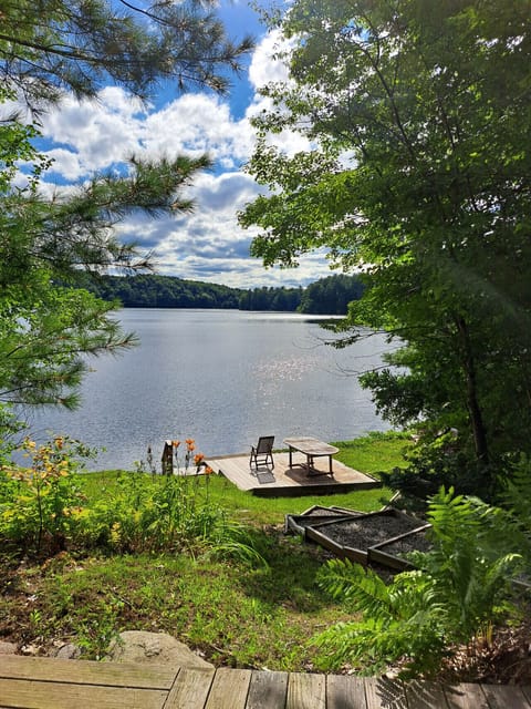 Scenic lakefront view with private dock perfect for canoeing or simply unwinding by the water.