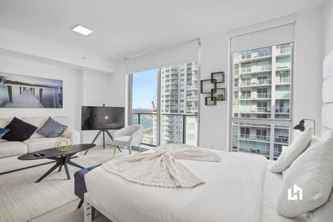 Enjoy the city and partial ocean view right from your bed
