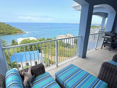 The covered balcony off the great room is a perfect spot to enjoy morning coffee or an evening beverage