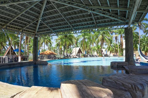 Indoor pool, 7 outdoor pools, open 10:00 AM to 8:00 PM, pool umbrellas