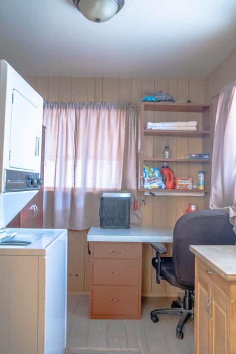 Laundry room with washer/dryer and workspace 