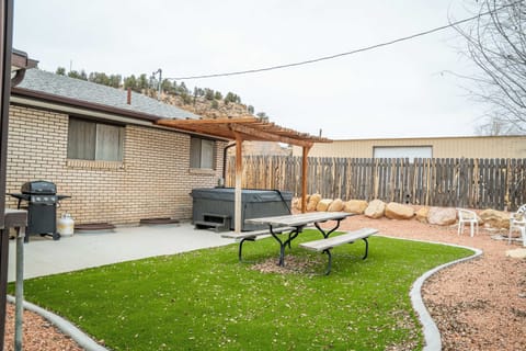 Great backyard with private hot tub!   Enjoy having a picnic outside while listening to the Virgin River run right out behind the house! 