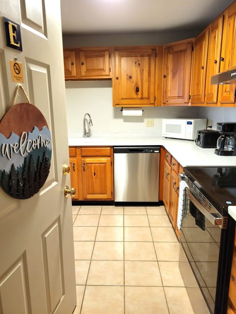 Enter condo through kitchen