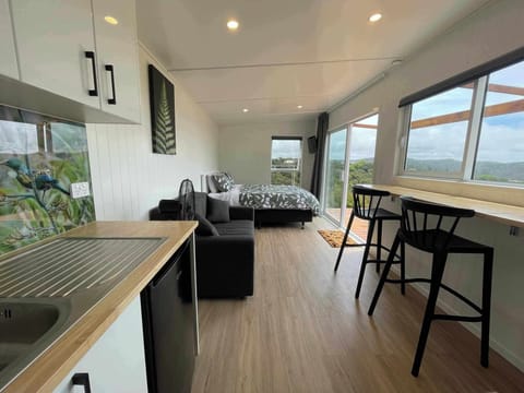Open plan living space with stunning seaviews and bush views with natural light.