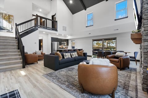 Spacious Open Floor Layout offers a Full Kitchen with Upgraded finishings and Appliances, a large Dining Table, a Cozy Living Area with a Streaming TV and a Fireplace, and a Total of 4 Bedrooms & 4 Baths