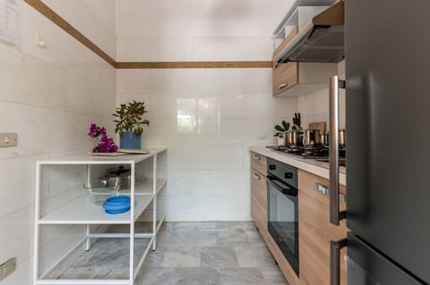 Flooring, Countertop, Interior Design, Kitchen, Cabinetry, Wood, Floor, Furniture, Kitchen Appliance, Major Appliance
