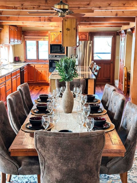 Unwind on the deck with plush seating and stunning views of the surrounding lake and greenery