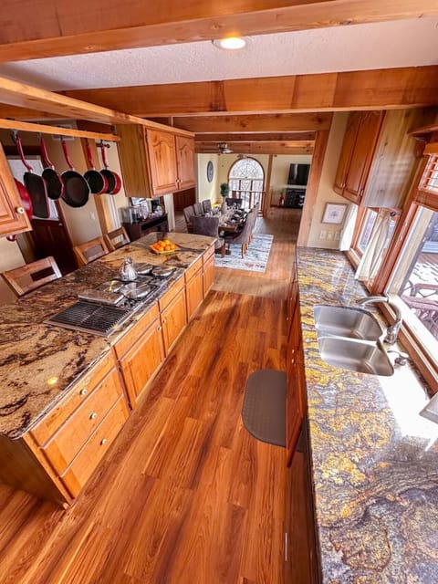 Beautiful kitchen with modern amenities, stunning natural light, and direct access to the dining and living spaces.