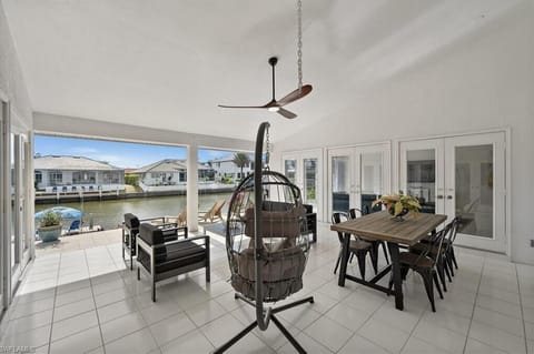Enjoy sitting and relaxing with some cocktails overlooking the sun drenched water