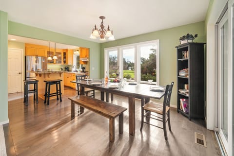 Dining room open to the fully equipped kitchen