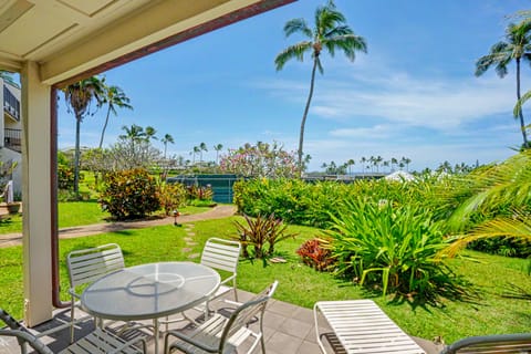 Stunning tropical property with swaying palms and lush landscaping beneath clear blue skies. Well-maintained grounds create a peaceful Hawaiian retreat.