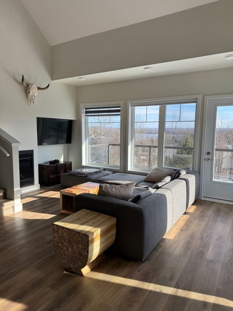 Bright, spacious living space with views of Peninsula Lake