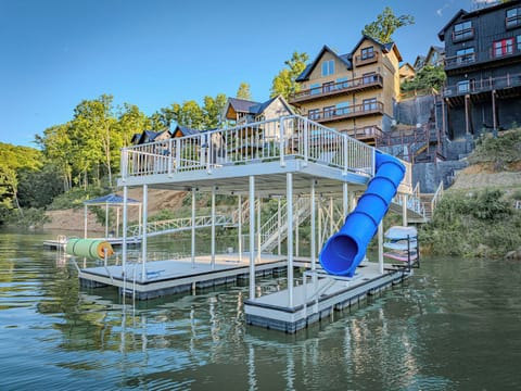 Two story dock with a slide and floating mat.