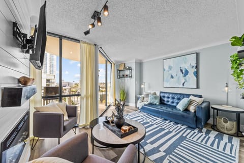 Modern comforts meet coastal decor in this inviting living room, perfect for unwinding by the beach.