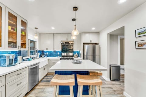 Kitchen: Keurig coffee maker, Crockpot, blender, cooking utensils, tableware