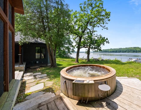 Soak away stress in the private cedar hot tub while enjoying panoramic views of Lake Wandawega. This backyard oasis is the perfect spot to unwind after a day of kayaking.