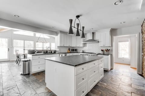 Gourmet Kitchen: Culinary adventures await in this stylish, sunlit space with modern appliances!