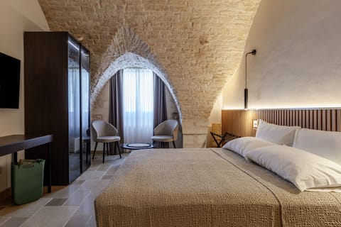 Superior Suite, City View | Minibar, in-room safe, desk, blackout drapes