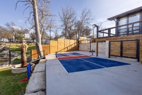 On-site pickleball court and basketball hoop with equipment included