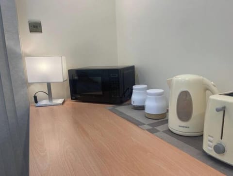 Kitchenette is equipped with microwave, kettle, toaster, fridge and hot drinks.