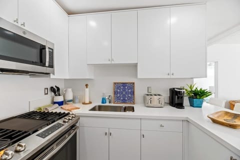 Kitchen is located right as you enter the home.  It has all kitchen essentials needed for a comfortable stay. 
Keurig Coffee make and coffee provided. 