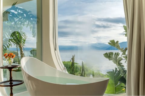 Luxury Triple Room, Sea View | Bathroom | Separate tub and shower, hair dryer, slippers, towels