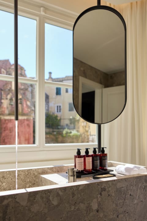 Deluxe Studio Suite, Sea View | Bathroom | Hair dryer, slippers, heated floors, towels