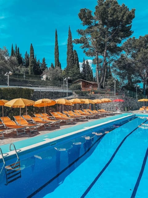 Seasonal outdoor pool, open 10:00 AM to 6:00 PM, pool umbrellas
