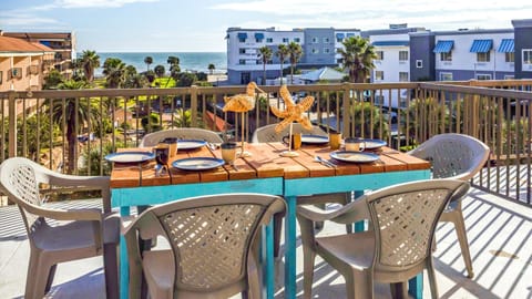 Beach and pool views from spacious balcony.