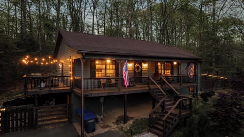 Cozy Bear Cabin glows with string lights—an easy welcome for cozy arrivals and late-night laughs.