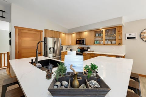 Full Kitchen with coffee maker, microwave, fridge, dishwasher, kettle, utensils