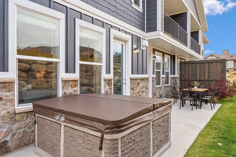 Relax on the patio with outdoor dining and a soothing hot tub—perfect after a day of adventure.