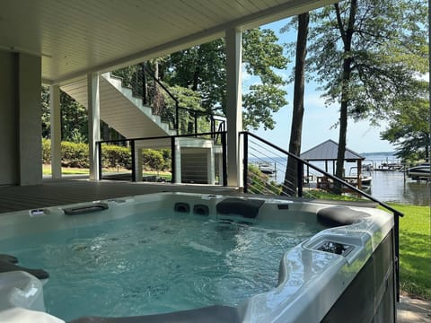 High end Bullfrog hot tub w/view of lake and large flatscreen TV