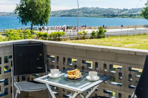 Balcony with scenic lake views and central town