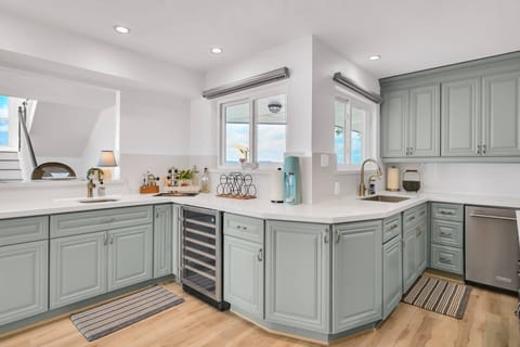 Kitchen wet bar with wine fridge and extra sink
