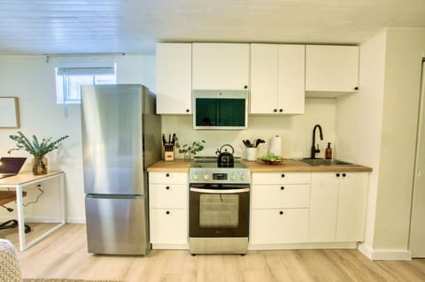 Modern kitchenette with brand-new appliances—fully equipped for your stay!