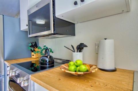 Prepare your favorite meals with ease in this kitchenette, complete with all the essentials for your stay.