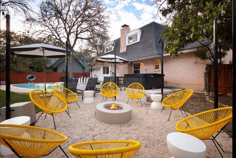 Gather around the firepit, surrounded by cozy chairs and just steps from the pool—perfect for evenings filled with warmth and laughter!