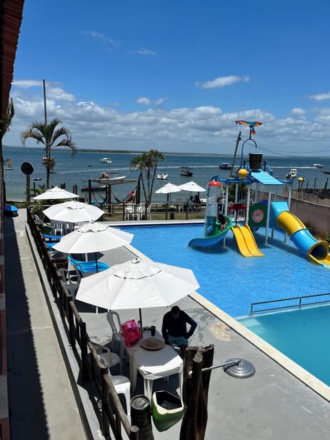 2 outdoor pools, open 9:00 AM to 7:00 PM, pool umbrellas