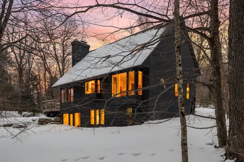 Mountain chalet at sunset. Cozy escape awaits!