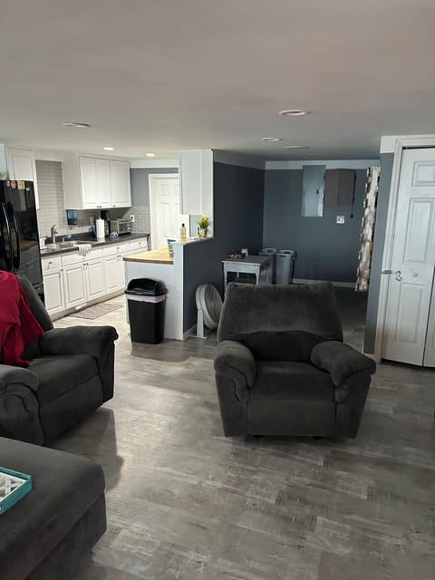 Kitchen with full fridge, stove, microwave, toaster over, coffee pot and Keurig