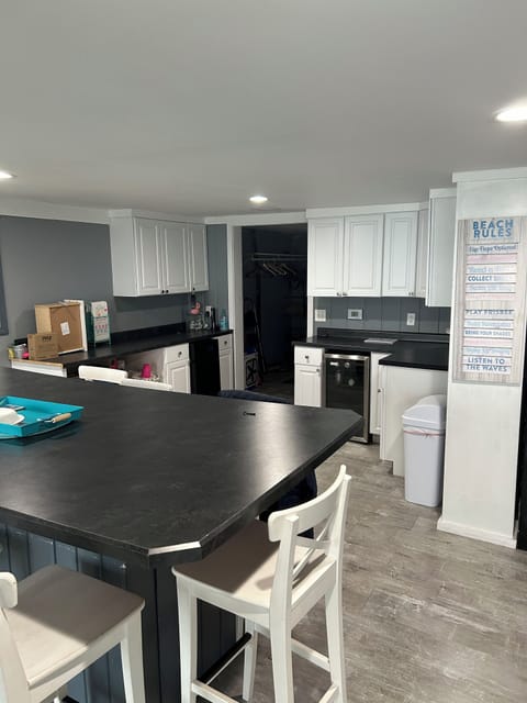 Large table that seats 8, plus bar area with wine and beverage fridge