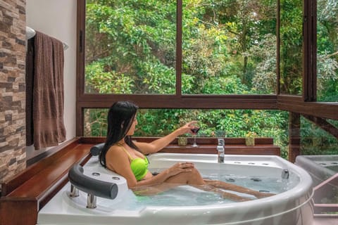 Deluxe Suite, Balcony, Garden View | Private spa tub