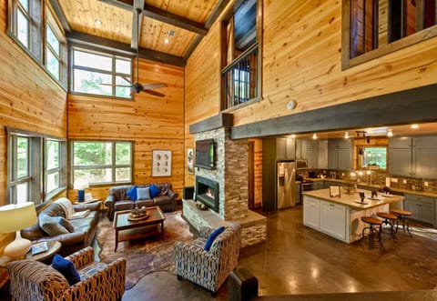 The open-concept design creates a seamless flow between the living, dining, and kitchen areas, making this cabin ideal for gathering together.