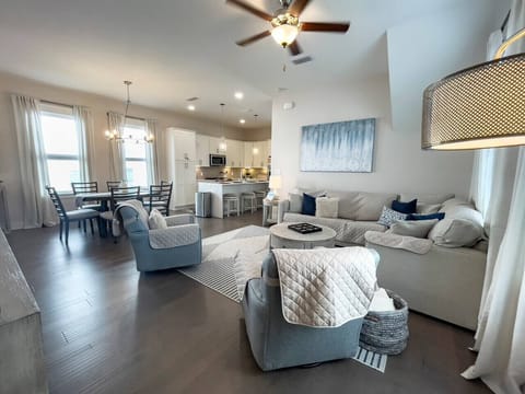 Coastal-modern living area with plenty of plush, comfortable seating.